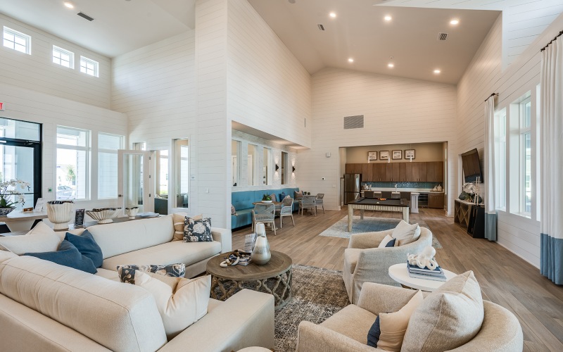 Large seating area in Abrazo at Four Corners clubhouse with an entertainment space located by our homes for rent in kissimmee florida with a pool.