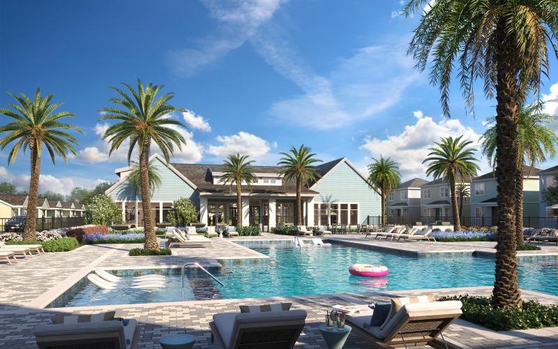 a pool with palm trees and a building in the background