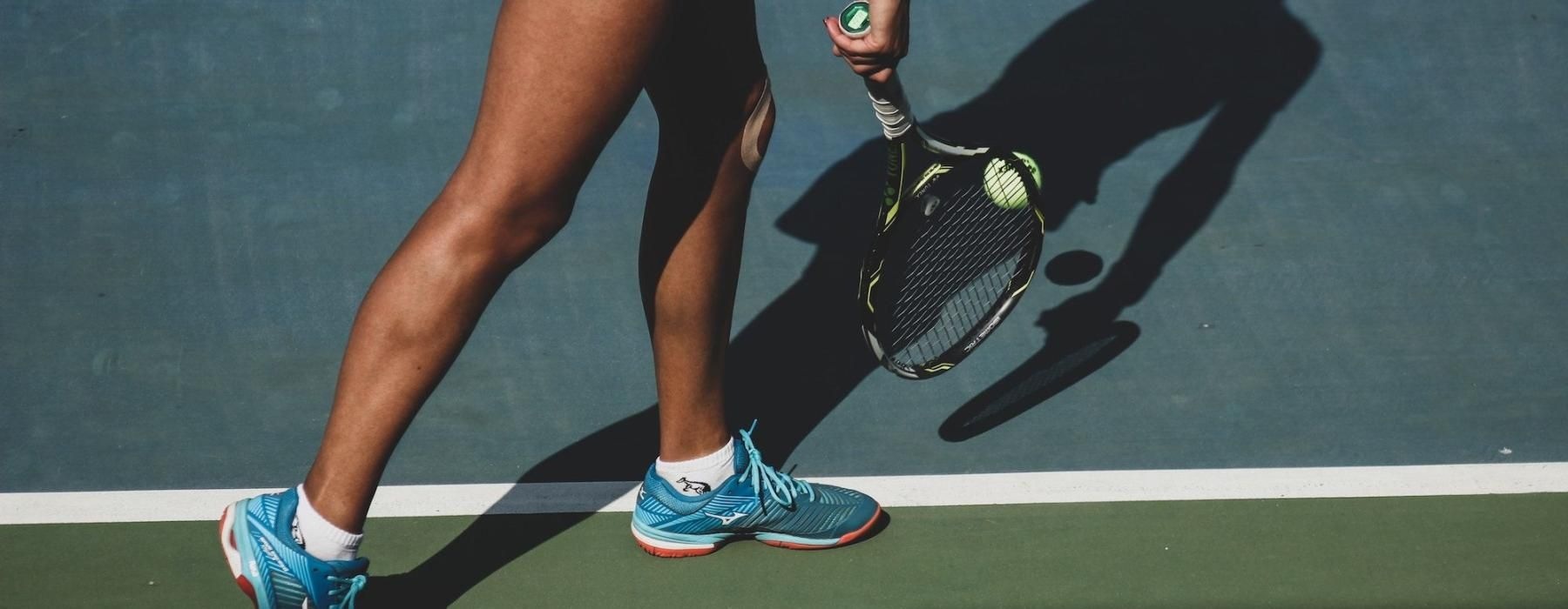 a person holding a tennis racket